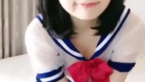 妹子小尺度诱惑情趣学生透视装椅子上漏奶自慰