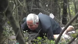 White-haired 81-year-old man in the woods