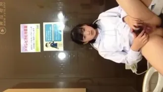 School girl takes selfie in toilet