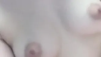 Beautiful young woman fucks herself and teases her lover at the same time