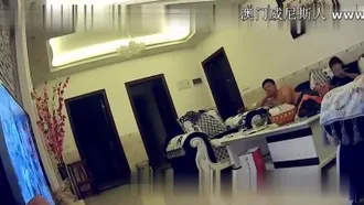 360 surveillance video of a middle-aged couple taking off his wife's underwear and having sex on the sofa