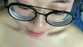 My ladylike girlfriend with glasses looked at me with an innocent look on her face while recording the short video. She lovingly lowered her head to take my dick in her mouth.