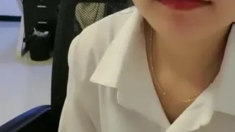 The young lady in the office flirts with the coworker and gets fucked directly on the chair in front of the desk