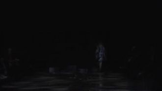 Inexplicable fashion show with models nearly naked on the catwalk