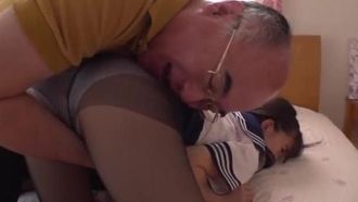 The cute granddaughter has just come home from school and uses her body to serve her elderly grandfather