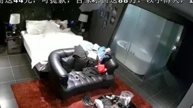 A couple was photographed having sex in a black leather sofa room