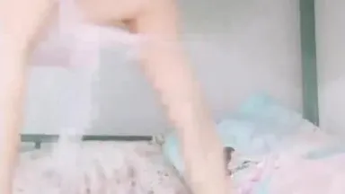 A very naughty young woman slowly takes off her clothes, touches her pussy, and then uses a vibrator to penetrate her pussy in the fourth part