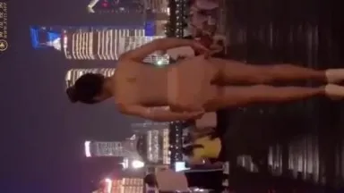 A bold Taiwanese girl takes off her underwear outdoors on the Bund in Shanghai