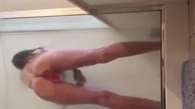 My girlfriend played with toys while washing her in the shower. She took a selfie video and showed it to me.