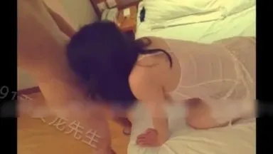 Mr. Long from Xi'an fucks the proprietress of the tea shop again. She kneels on the bed in sexy underwear with exposed breasts and licks the big dick. She hugs a big white leg and fucks it hard.