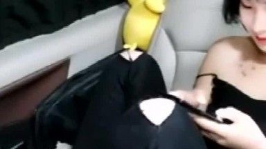 A good-looking girl with short hair gets fucked by two people in a car. Blowjob in the back seat of the car, riding on top and penetrated hard from behind