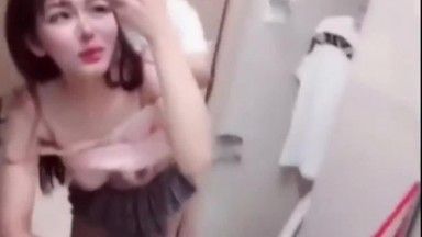 Boyfriend fucks her from behind in pleated skirt in bathroom